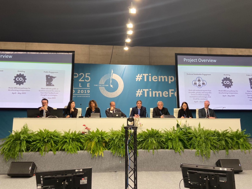 Image of panel discussing how subnational governments can reduce transportation emissions