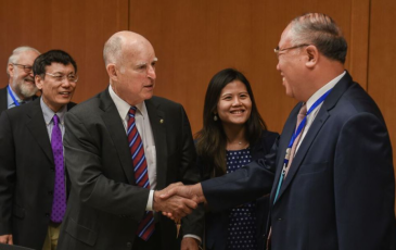 Jerry Brown and Xie Zhenhua shaking hands